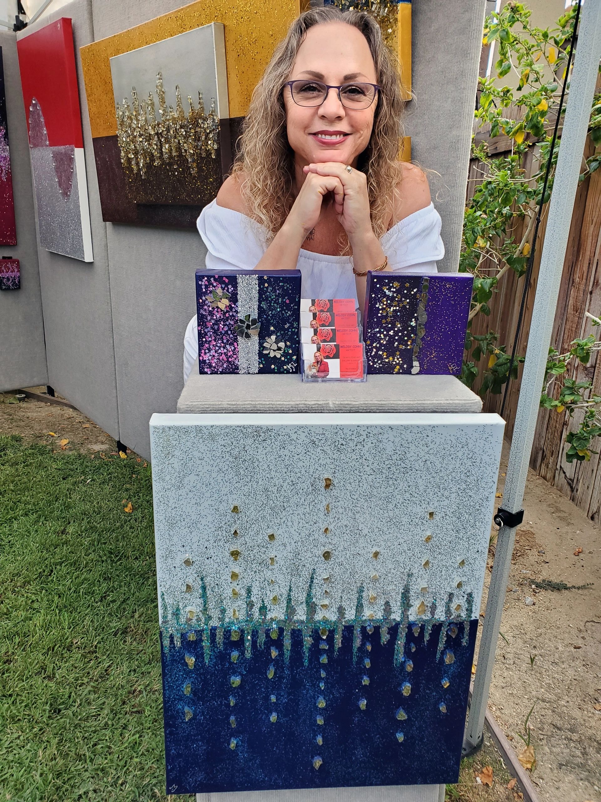 Melody displaying her colorful art